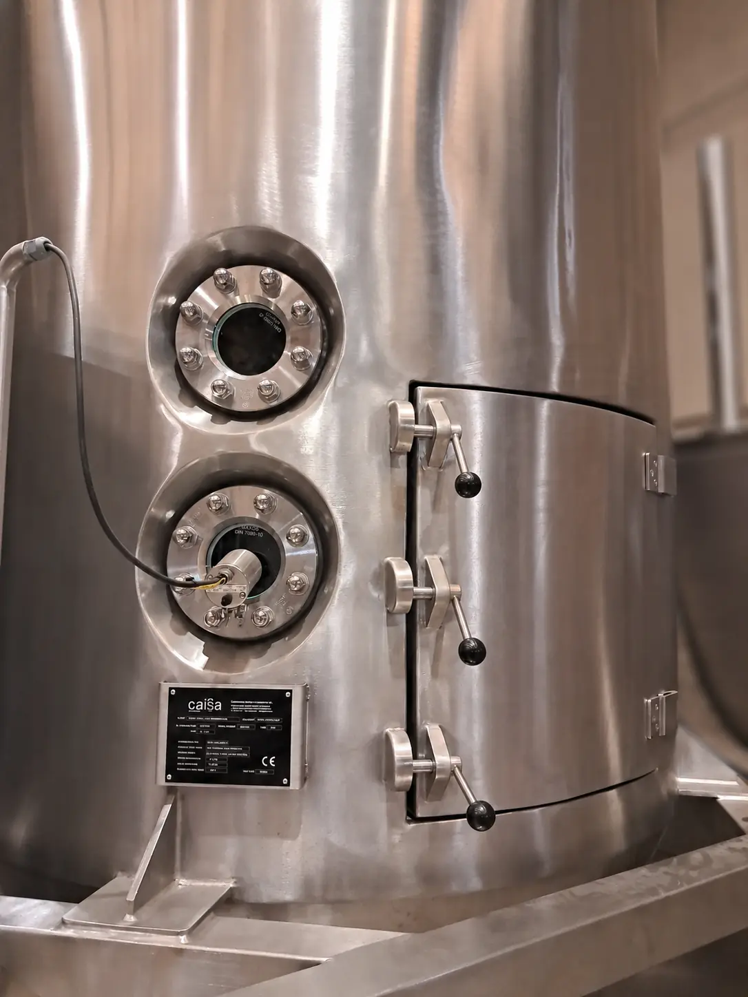 Detail of the drying chamber with sight glasses and CAISA nameplate